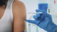 Woman being vaccinated