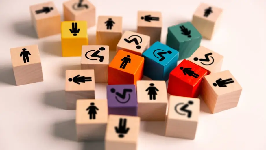 Wooden cubes that represent concept of inclusion and equity