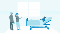 Student pharmacists talk to patient in hospital