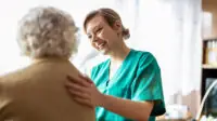 A healthcare professional visits a patient's home