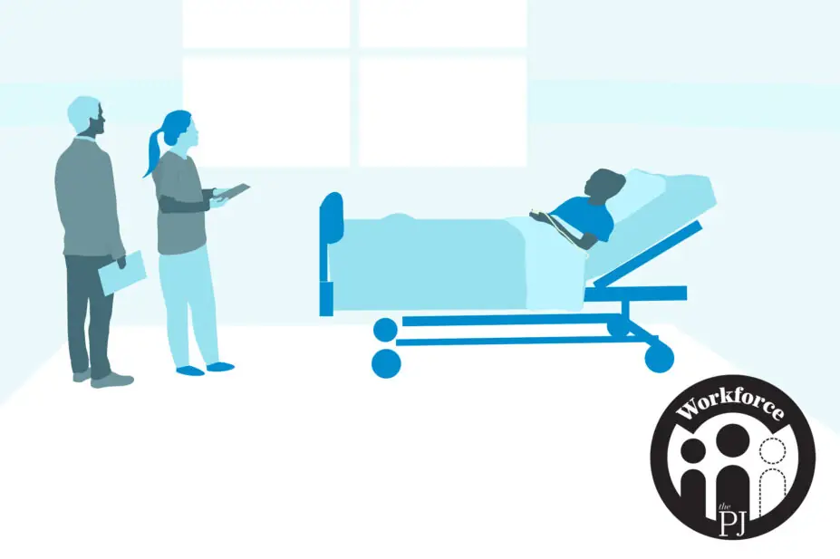 Student pharmacists talk to patient in hospital