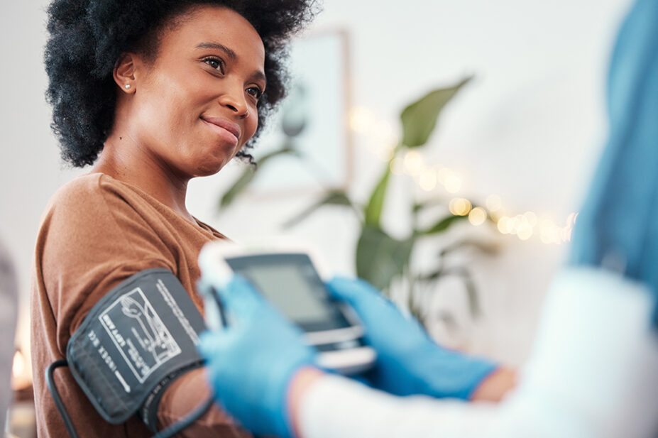 A woman receives a ambulatory blood pressure check