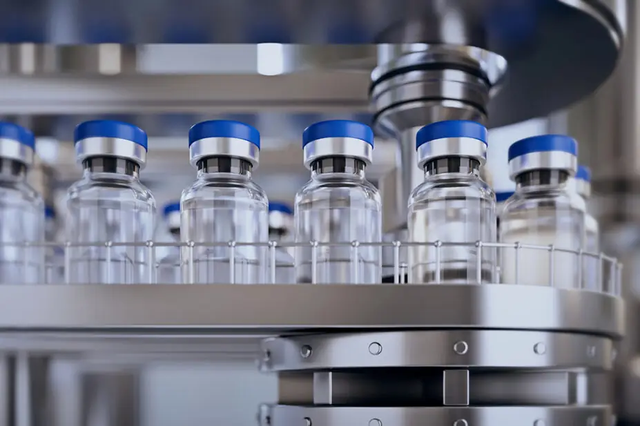 Vials of vaccines on a conveyor belt