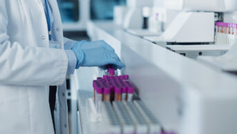 A scientist analyses blood samples