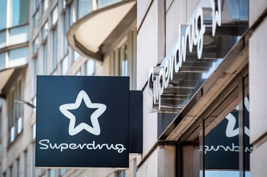 Superdrug logo on high street pharmacy store