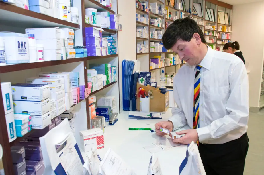 A pharmacist checks prescriptions