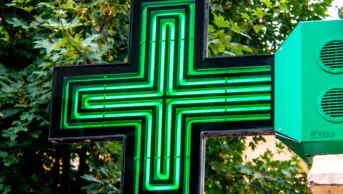 The sign outside of a community pharmacy