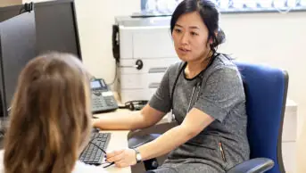 A clinician consults with a patient