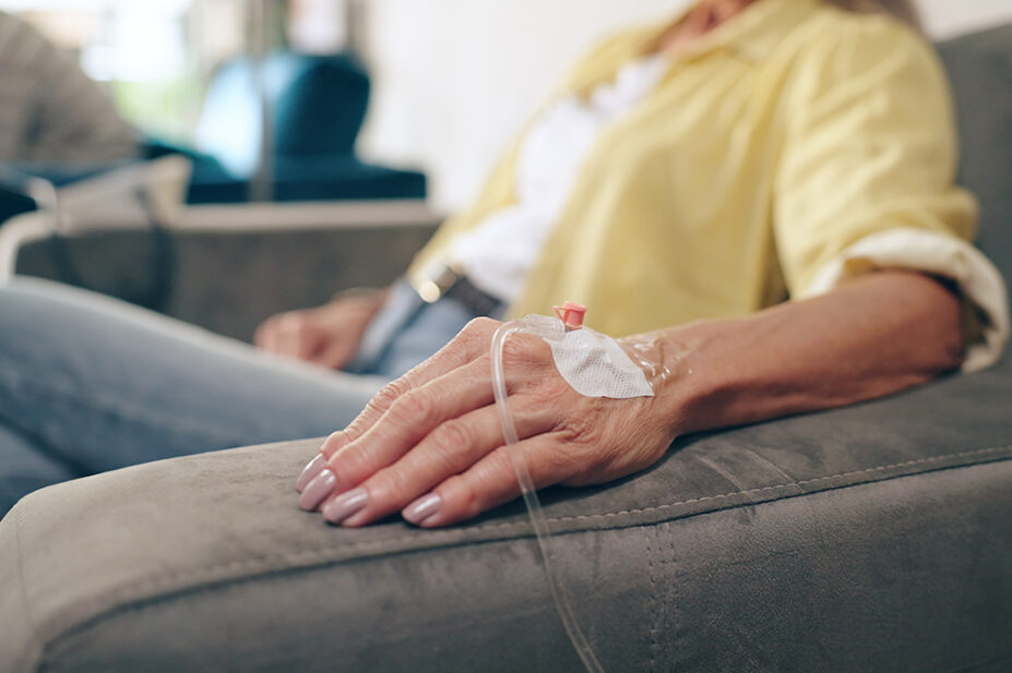 A woman receives an treatment via an IV