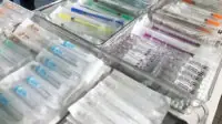 Packets of needles on display at a drug consumption room