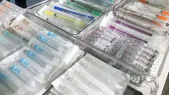 Packets of needles on display at a drug consumption room