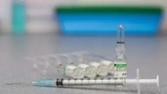 Vials of morphine solution and a needle