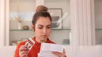 Female patient reads medication information leaflet