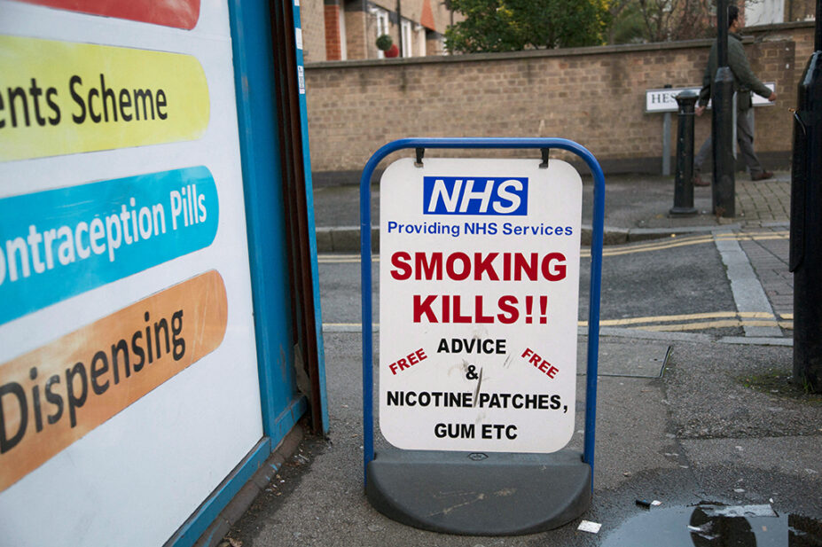 NHS 'smoking kills' sign outside a pharmacy in London