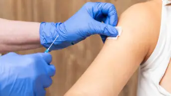 A patient receives a vaccination