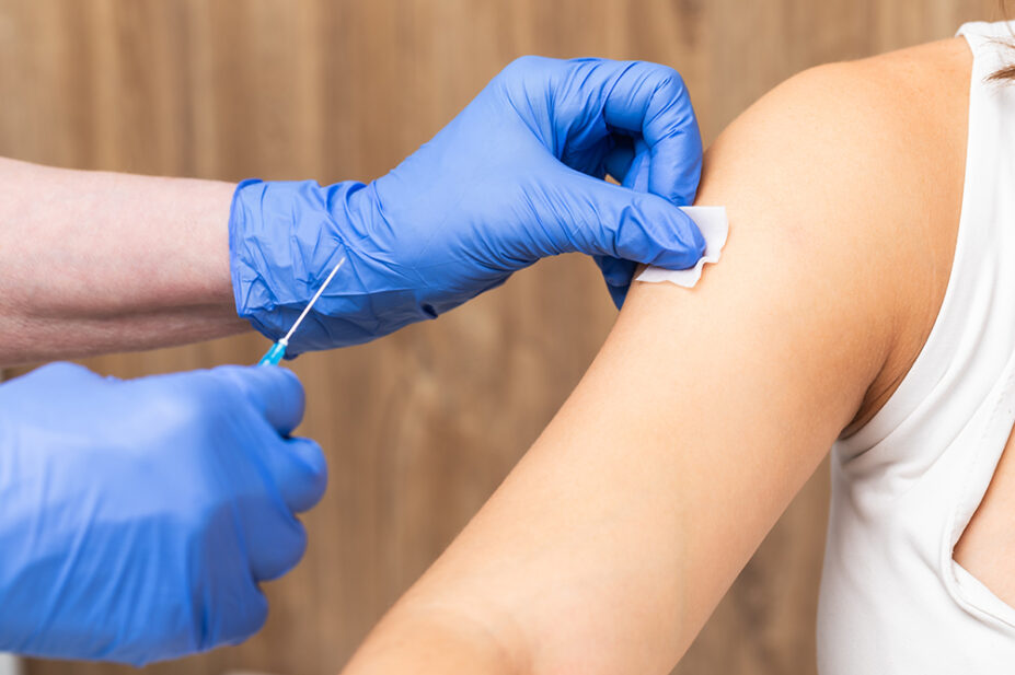 A patient receives a vaccination