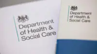 A photo of official letters from the Department of Health & Social Care