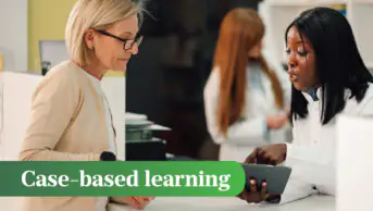 Pharmacist standing at pharmacy with tablet in hands and having consultation with senior woman