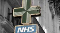Community pharmacy NHS sign outside a building