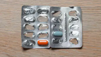 A blister pack of medicines that is almost empty