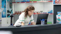 A female pharmacist on a computer in the dispensary