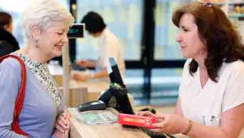 A pharmacist consults with a customer