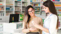 A pharmacist consults with a patient
