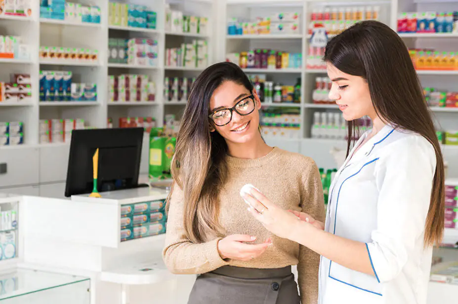 A pharmacist consults with a patient