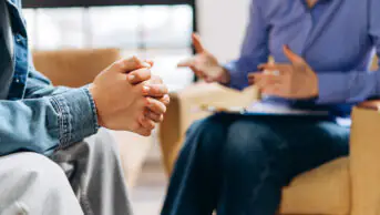 A teenager consults with a healthcare professional