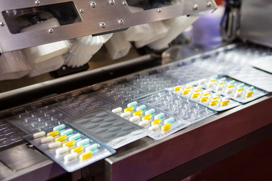 A machine packages tablets into blister packs