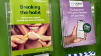 Brochures for medical advice, including stop smoking, are pictured inside pharmacy