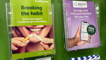 Brochures for medical advice, including stop smoking, are pictured inside pharmacy