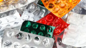 A assortment of empty blister packs of medicines