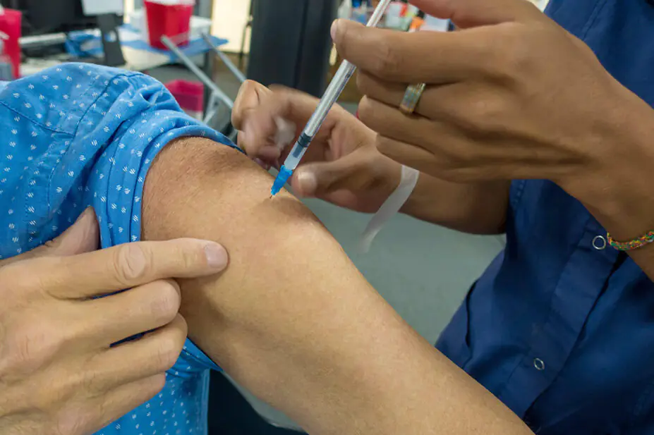A patient receives a vaccination