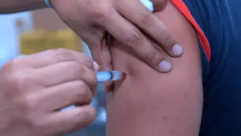 A person receives a vaccination