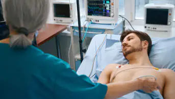 Patient in hospital undergoing a heart scan