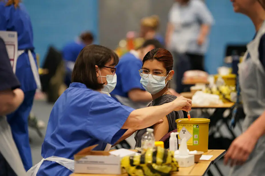 A student receiving an injection in the sports hall at the University of Kent campus in Canterbury as the number of cases of meningitis being investigated by the UK Health Security Agency (UKHSA) in Kent