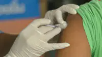Someone receiving a vaccination