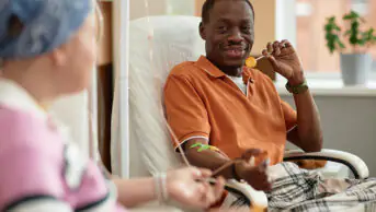 A man and a women receive chemotherapy