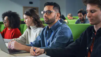 University students take notes in class