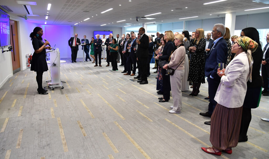 Tase gives talk to room full of people