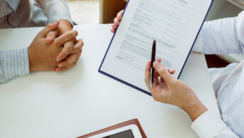 A doctor conducts a structured medication review with a patient