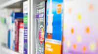 Shelf of allergy treatments in pharmacy