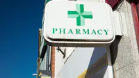Pharmacy sign outside a UK pharmacy