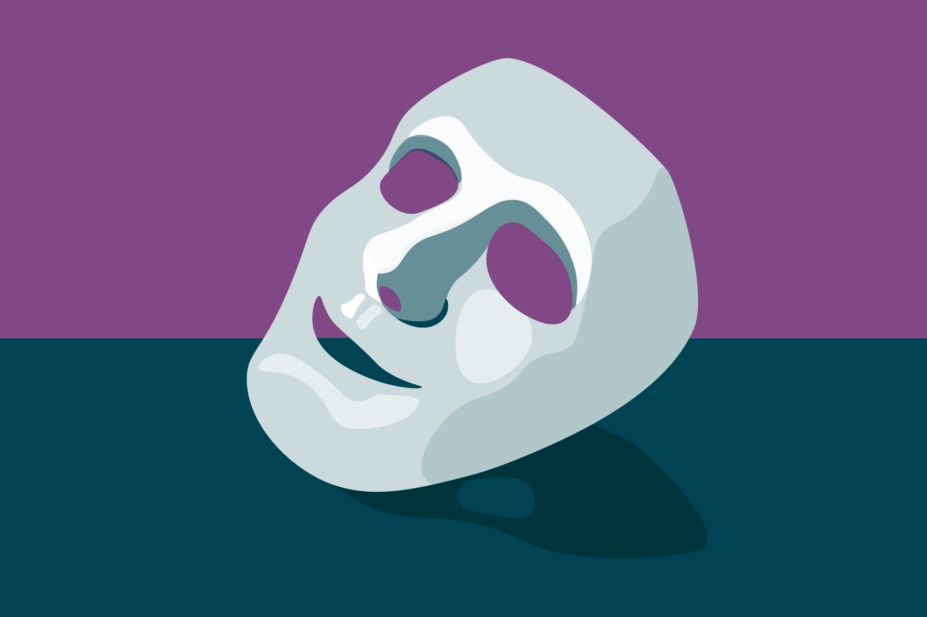 Purple background, grey table with a white/grey mask on top with a forced smile