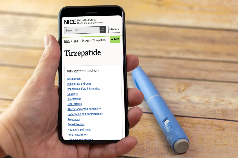 Person holding phone open to the BNF NICE page for Tirzepatide. A semaglutide injector pen rests on the table behind.