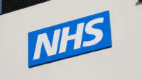 The NHS logo outside of a health centre