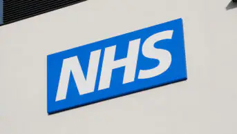 The NHS logo outside of a health centre