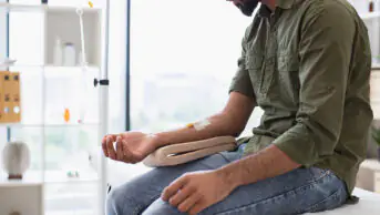 A man receives cancer treatment via an IV