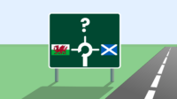 Motorway style sign with Welsh flag and Scottish flag showing destinations and a question mark to represent England. Road to the right